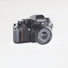 A Nikon F3 single-lens reflex film camera.