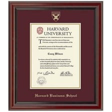A business school graduate holding a diploma