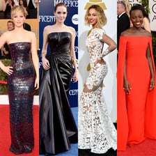 A famous celebrity posing for photographers on a red carpet