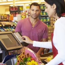 A customer paying for an item at a shop checkout.