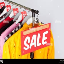 A retail store displaying sale signs