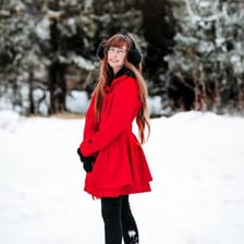 A person wearing a red coat