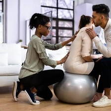 A doula providing support to someone in labor.