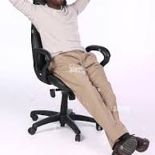 A person resting comfortably in a chair.