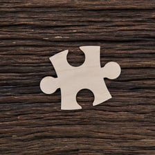 A single interlocking jigsaw puzzle piece.