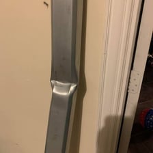 A stiff metal bar shown resisting bending.