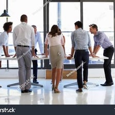 A person speaking in support of a colleague at a meeting.