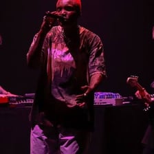 Singer Arlo Parks performing on stage