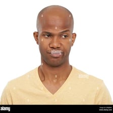 A person showing an unimpressed, indifferent facial expression.