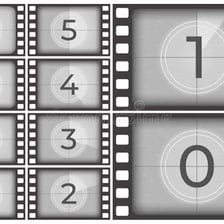 A film reel and a movie projected onto a screen.