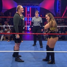 A wrestler holding an opponent during a match.