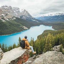 A person gazing in amazement at a dramatic natural scene.