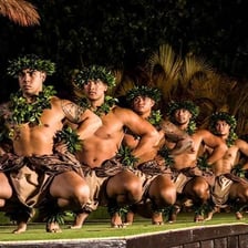 A hula dancer performing traditional hand gestures.