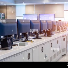 Desktop personal computers arranged in a computer laboratory.