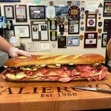 A hero sandwich displayed at a deli counter