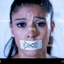 Close-up of a person with closed lips.