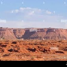 Flat-topped mesas rising from a Southwestern desert