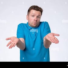 A person shrugging to express that they do not know the answer.