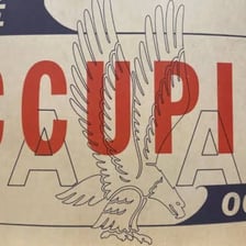 A reserved sign placed on an occupied seat.