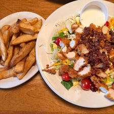 A restaurant menu listing several side-dish options.