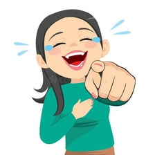 A person smiling with a subdued amused expression