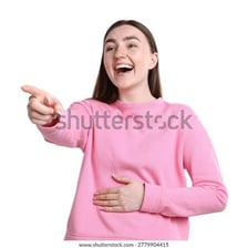 A person smiling and giggling.