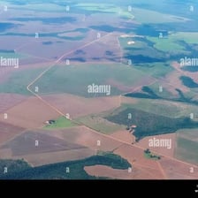 A broad, clearly defined area of rural land seen from above.