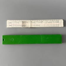 A vintage slide rule, a linear manual calculating instrument.