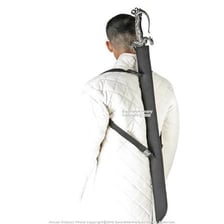 A sword being inserted into its sheath.