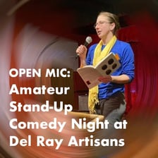Amateur comedian performing onstage at an open mic