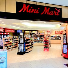 A small convenience store beside a gas station