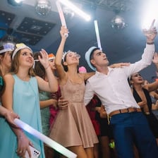 A lively group of people celebrating at a nighttime party