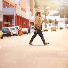 A person walking leisurely along a path