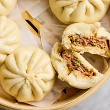 A steamed Chinese bao bun with a soft white wrapper