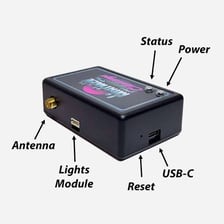 A close-up of a reset button on an electronic device.
