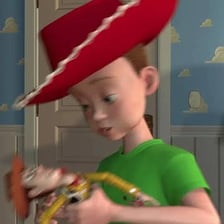 Andy from Toy Story pictured with Woody and other toys.
