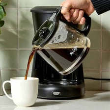 Coffee brewing in a pot or coffee maker.