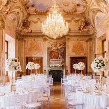An opulently decorated ballroom prepared for a formal ball