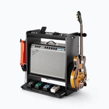 A guitar amplifier positioned on a concert stage