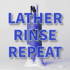 A shampoo bottle displaying the familiar rinse-and-repeat instruction.