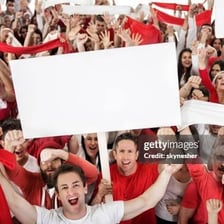 Group of enthusiastic fans gathered to support a celebrity