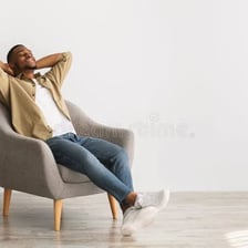 A person relaxing in a comfortable chair.