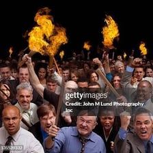 A person provoking a visibly agitated crowd