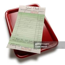 A restaurant bill showing charges for a meal