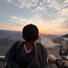 A person viewing a breathtaking mountain landscape