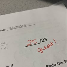 A test paper marked with a perfect score.