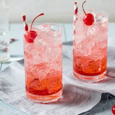 Colorful nonalcoholic drinks served in glasses.