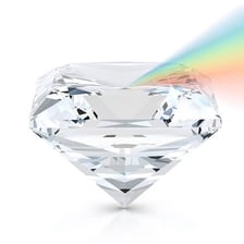 A faceted diamond reflecting bright light.