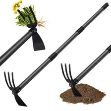 A garden hoe being used to cultivate soil