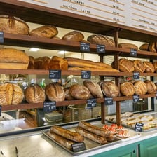Freshly baked bread and pastries displayed in a bakery